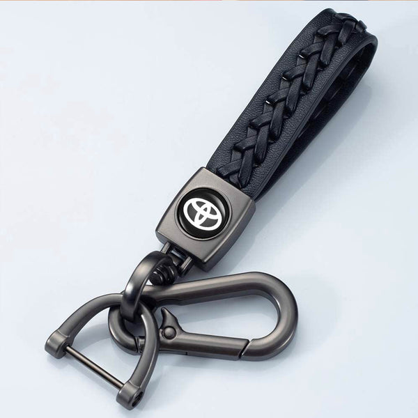 Premium keychain featuring a leather strap and a metal badge with the logo